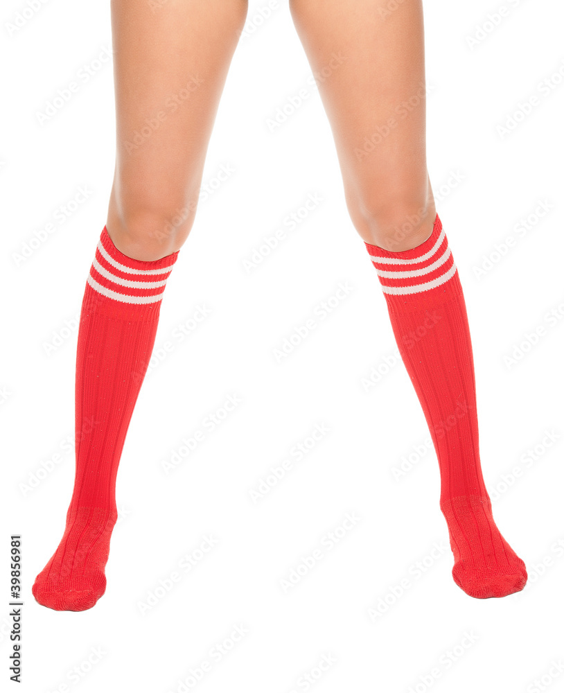 a close up of female legs with soccer socks a close up of female legs with soccer socks