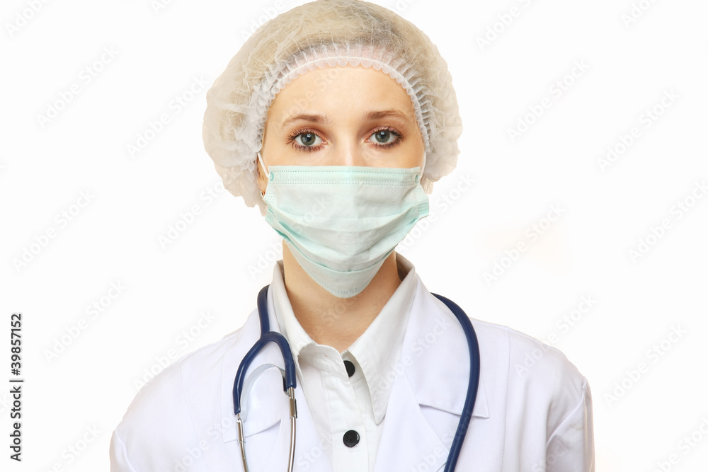 Closeup portrait of a young doctor wearing a mask isolated on wh Closeup portrait of a young doctor wearing a mask isolated on wh
