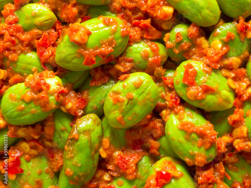close up of petai beans in sambal sauce food background photo