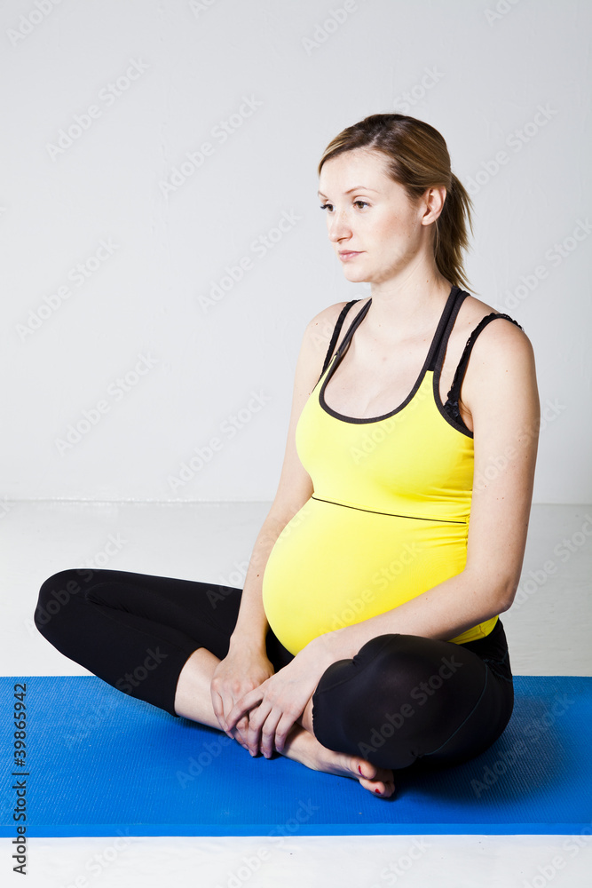 Fototapeta premium Pregnant woman stretching