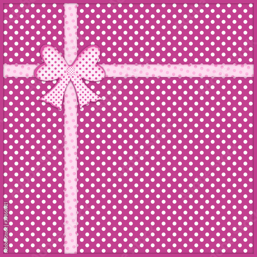 Gift bow and ribbon on purple polka dot background