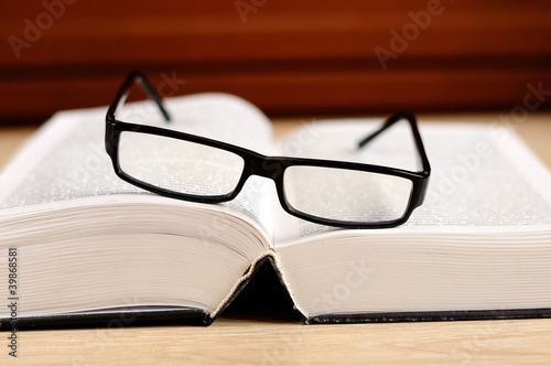 book and eyeglasses