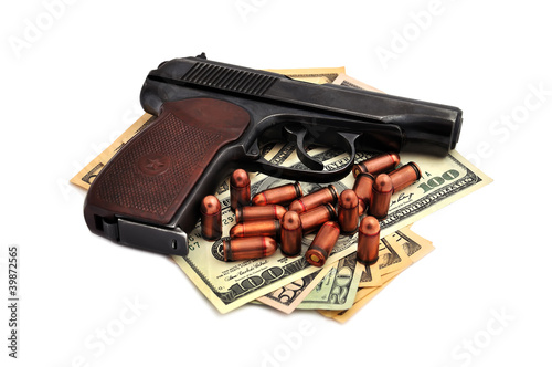 pistol, cartridges and dollars