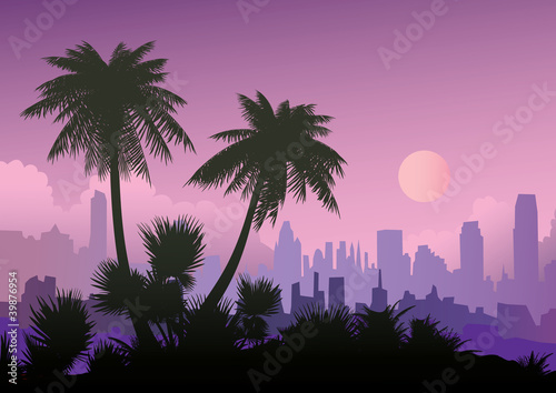 Silhouette of palm trees on the city background.