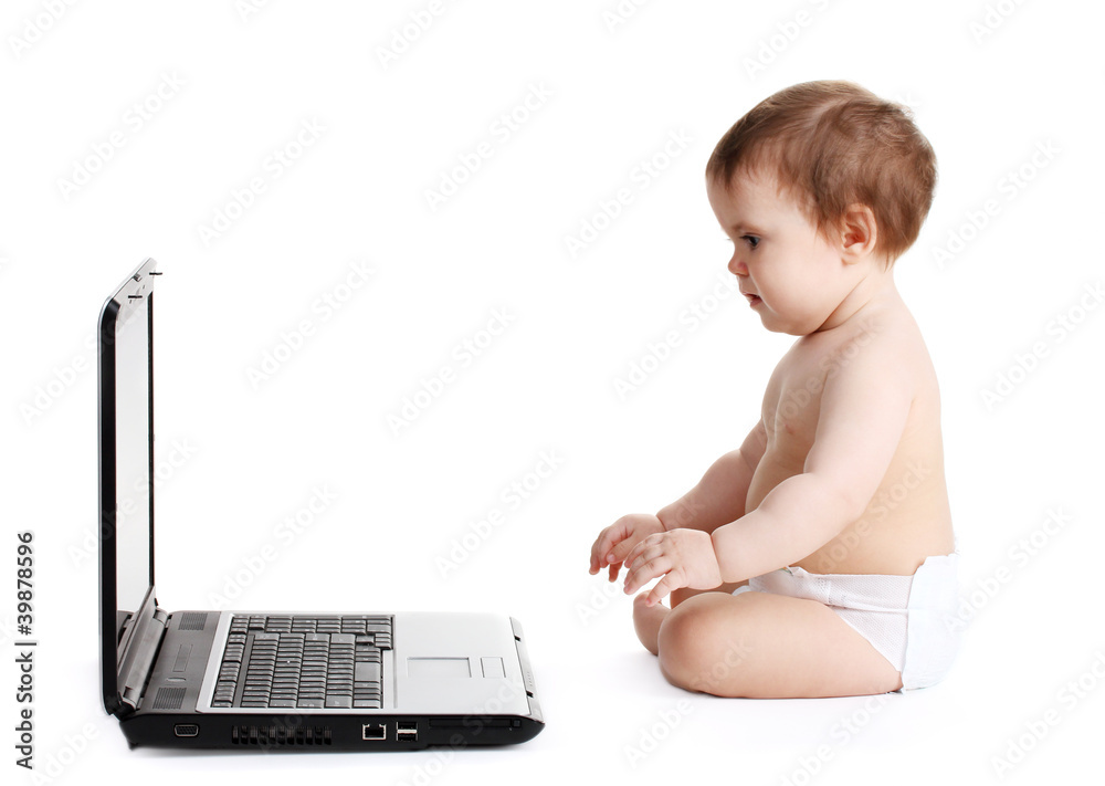 Cute baby girl and laptop isolated on white Cute baby girl and laptop isolated on white