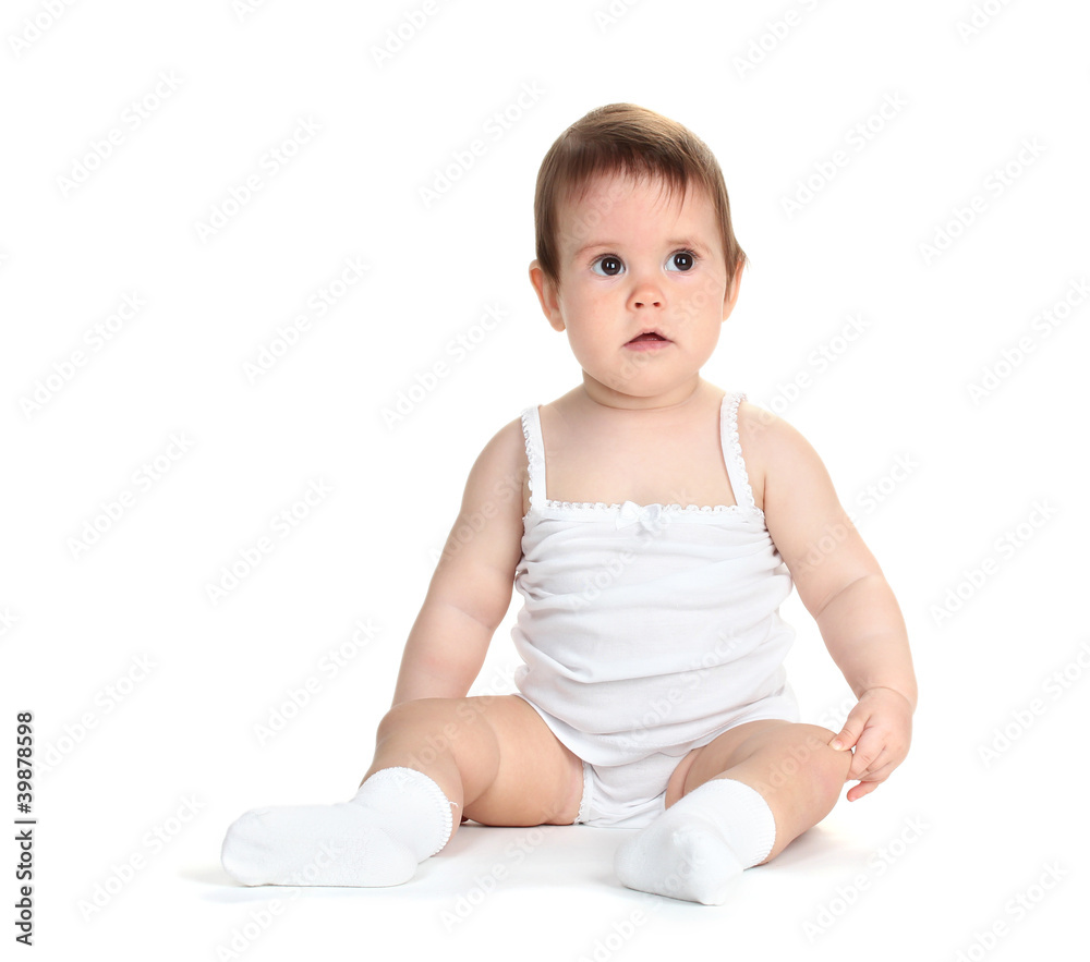 Cute baby girl sitting isolated on white Cute baby girl sitting isolated on white