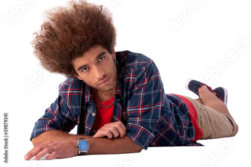 young man lying, isolated on white, studio shot