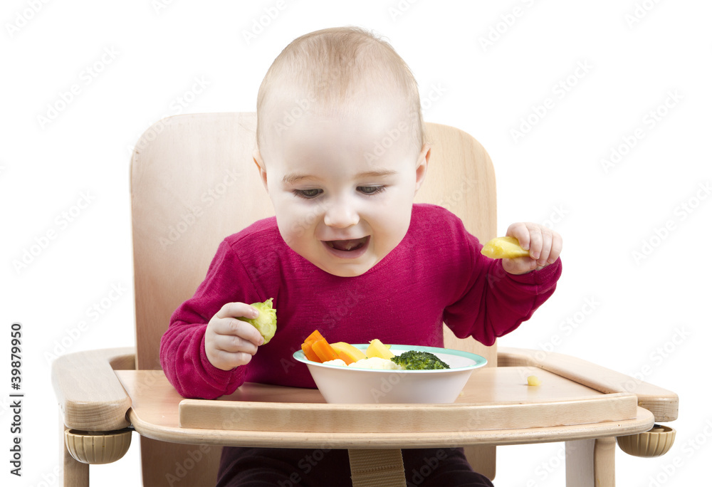 young child eating in high chair young child eating in high chair