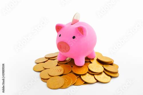 Piggy bank and gold coins