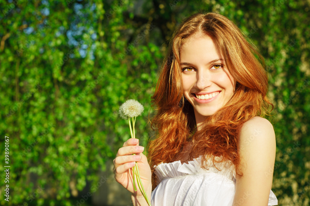 Girl with a dandelion in his hand Girl with a dandelion in his hand