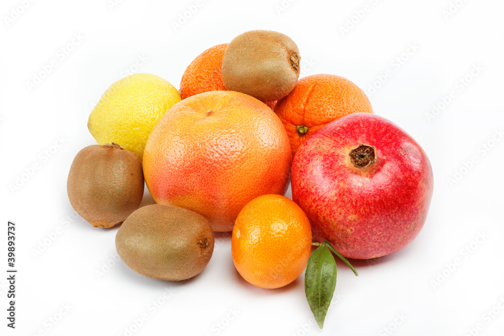 pomegranates and citrus fruits isolated on a white background. pomegranates and citrus fruits isolated on a white background.