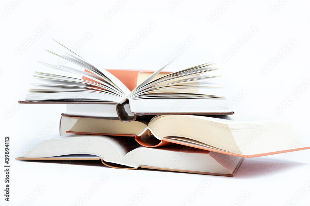 Fototapeta premium A stack of books on a white background.