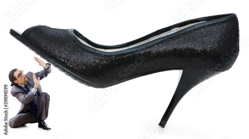 Obraz na plátně Woman domination concept with shoes and man