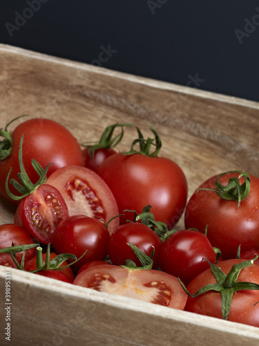 Red Tomatoes In Wooden Bowl