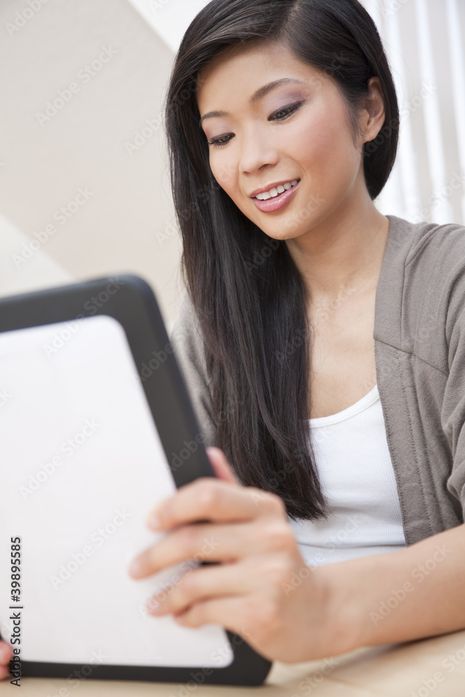 Asian Oriental Chinese Woman Using Tablet Computer Asian Oriental Chinese Woman Using Tablet Computer