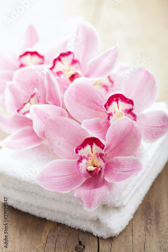 orchid flowers and towels for spa