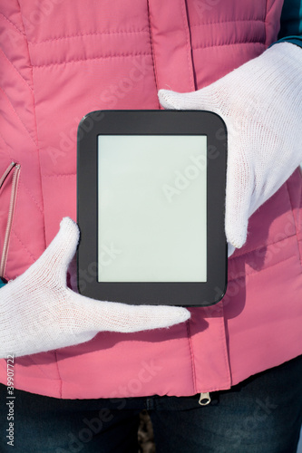 Woman's hands holding e-book reader