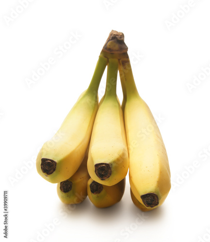 Fresh and tasty yellow babanas on a white background photo