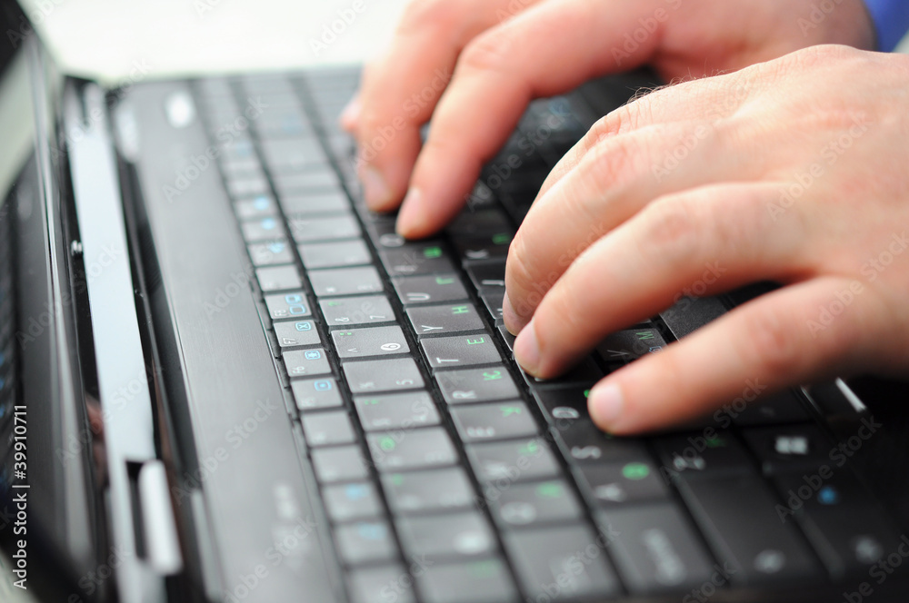 Typing on a laptop Typing on a laptop