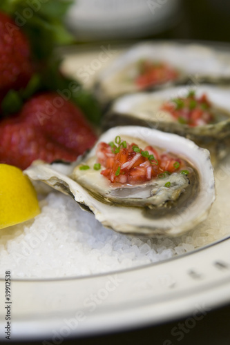 Oysters with strawberry mignonette vinaigrette on ice