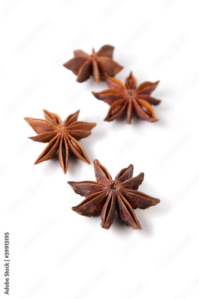 Several anise stars isolated on white background