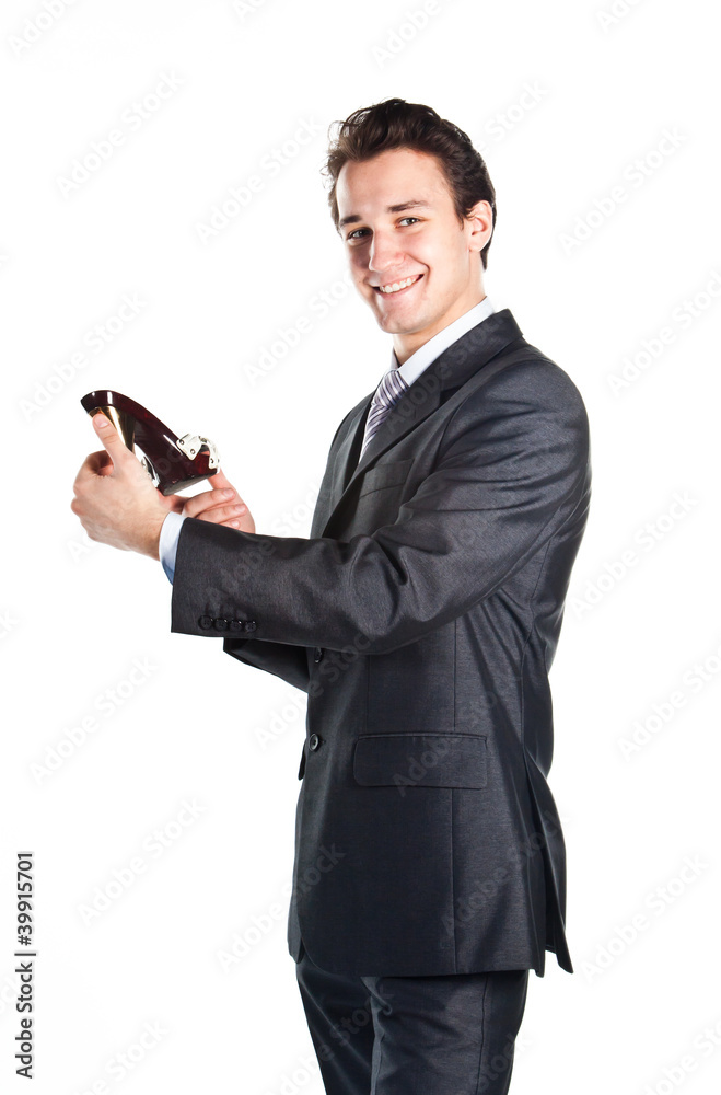 Young businessman with hands in the women's shoes Young businessman with hands in the women's shoes