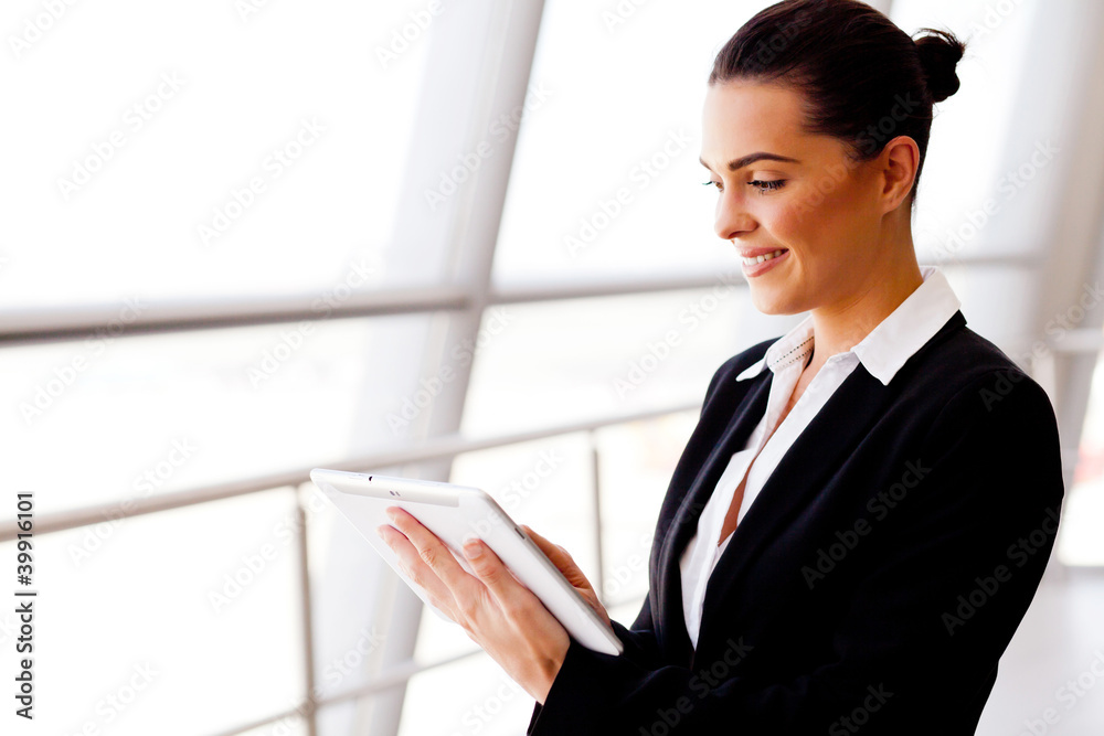 young businesswoman using tablet computer young businesswoman using tablet computer