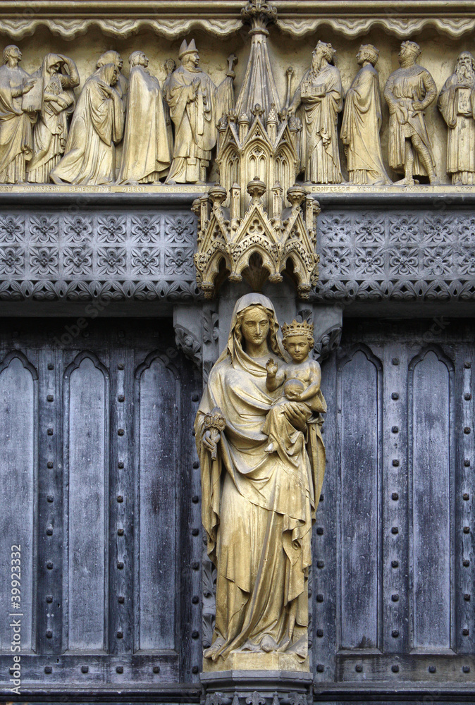 Mary and Jesus statue on the facade of a church