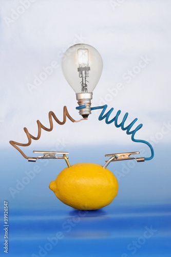 lemon and lamp on white background