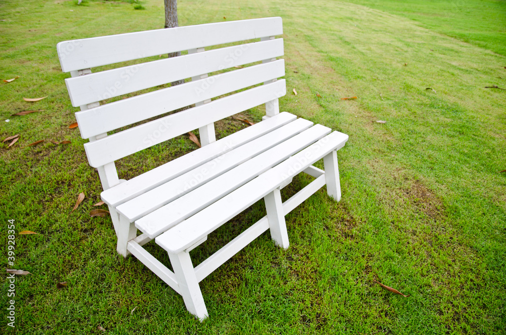 White chair in the park for rest and relax. White chair in the park for rest and relax.