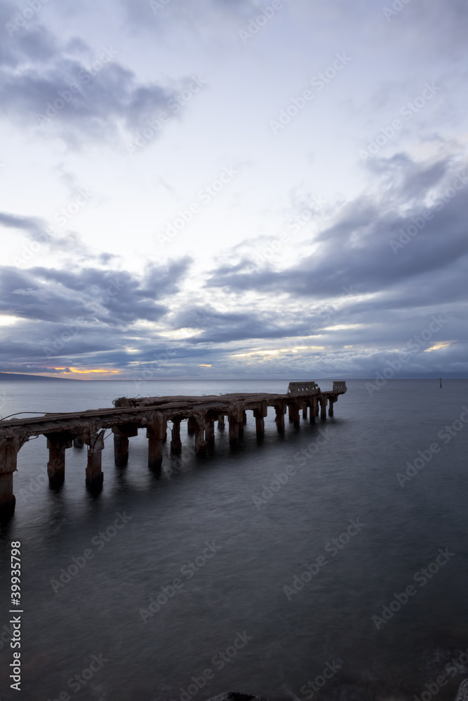 dipadated concrete pier  during sunset at lahaina, maui
