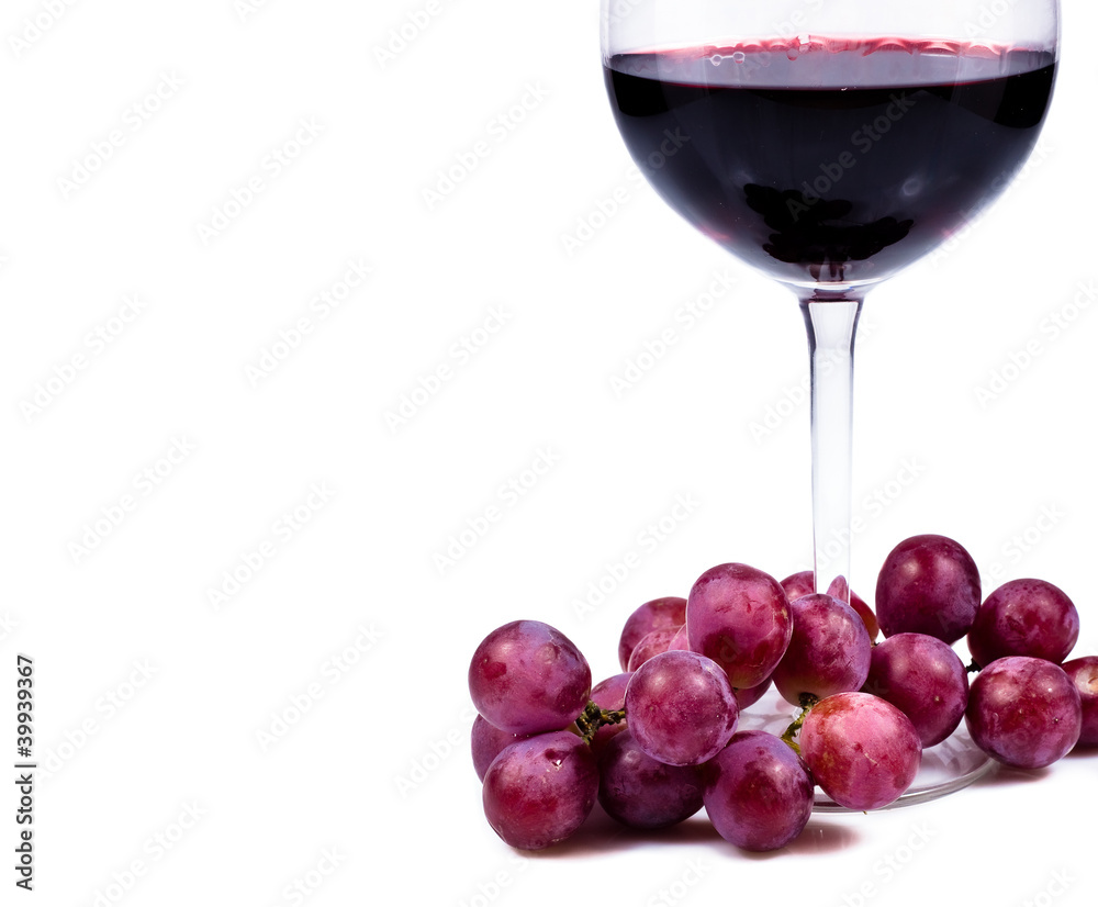 wine glass with red wine and grapes