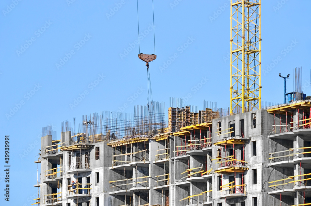 Building construction site against blue sky