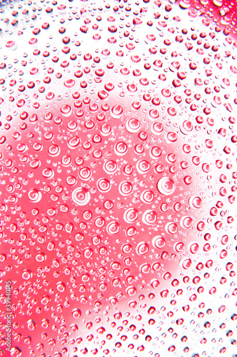 Water drops on glass red and white color photo