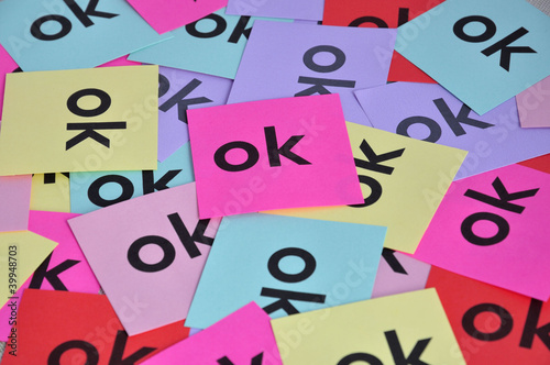 Pile of colorful paper notes with "OK" word