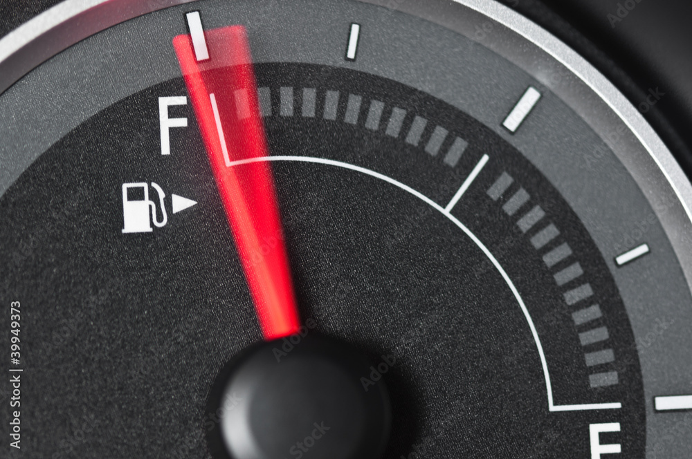 Naklejka premium Fuel gauge with motion blurred needle