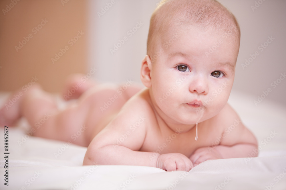 Drooling in a child. portrait a little baby with saliva. funny boy 4 month old Drooling in a child. portrait a little baby with saliva. funny boy 4 month old