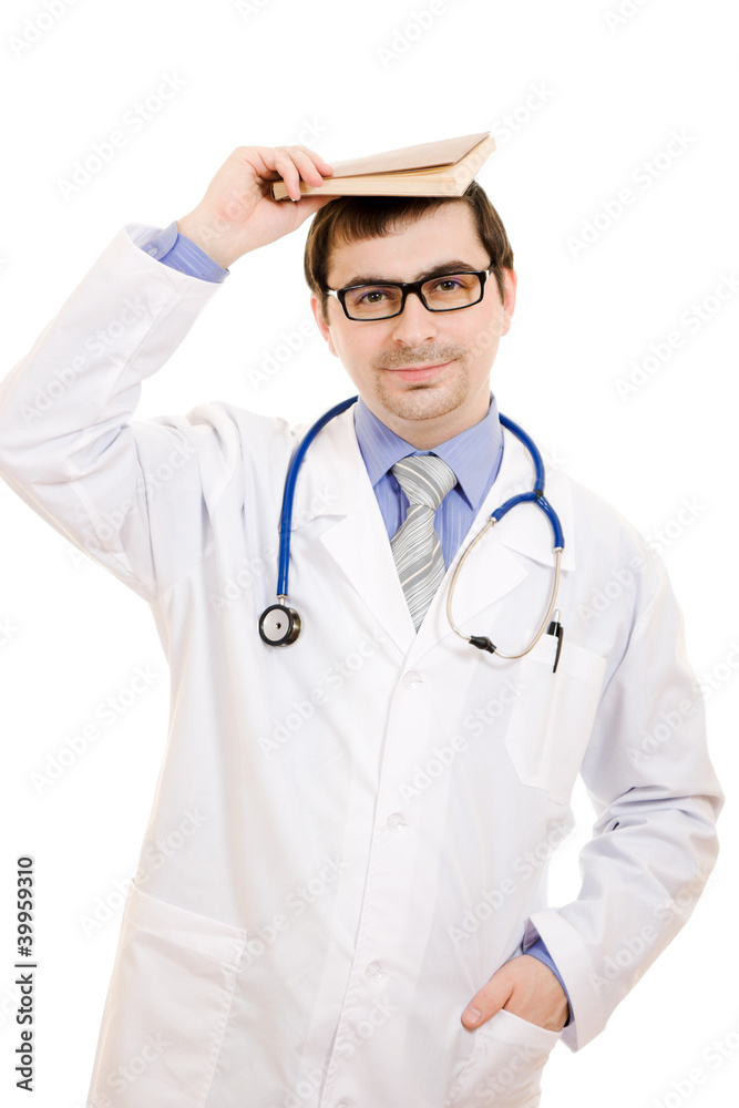 The doctor with a book on his head on a white background. The doctor with a book on his head on a white background.
