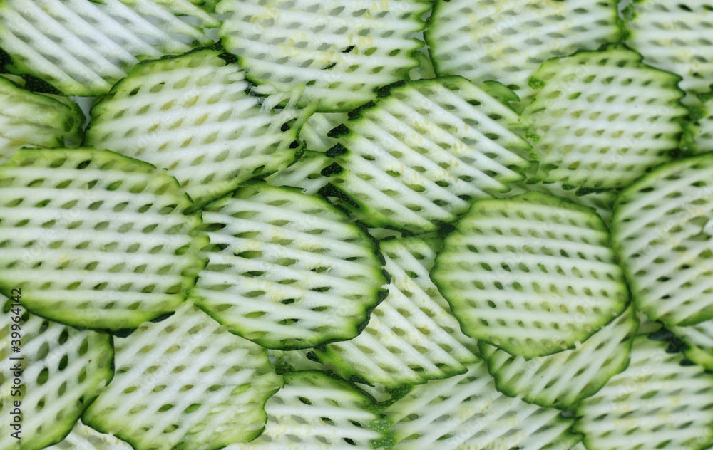 Decorated background of sliced snake gourds Decorated background of sliced snake gourds