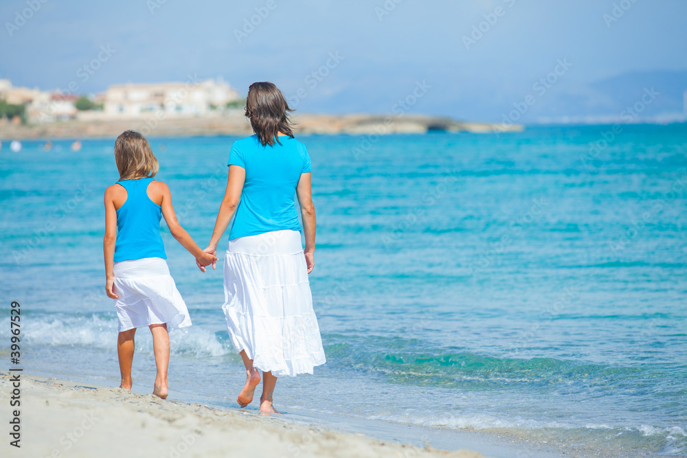 Mother and her daughter having fun on beach Mother and her daughter having fun on beach