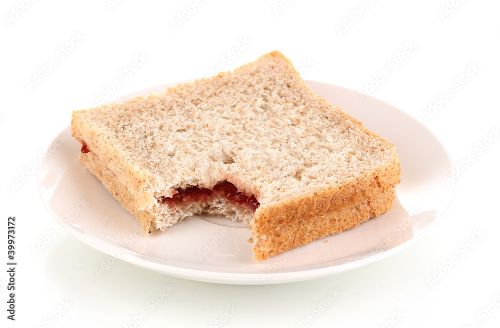 Bitten sandwich with jam on plate isolated on white Bitten sandwich with jam on plate isolated on white