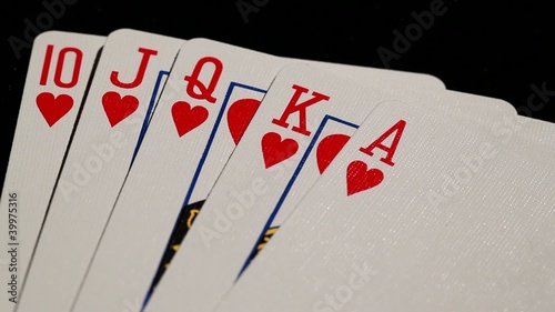 royal flush being spread high contrast  black background