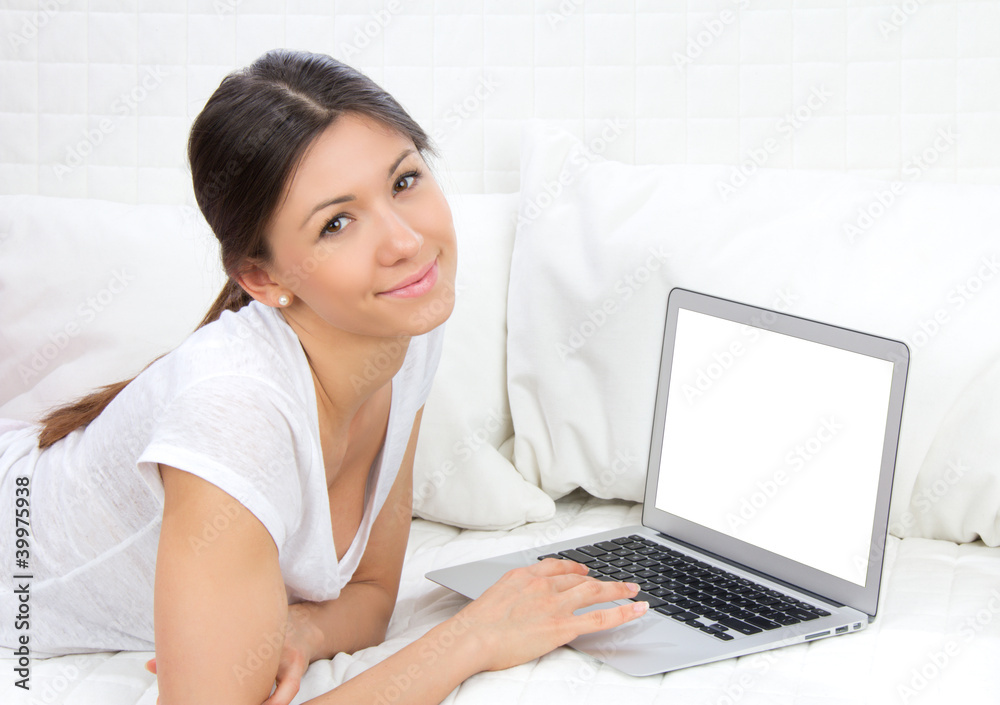woman lying on the sofa with modern laptop woman lying on the sofa with modern laptop