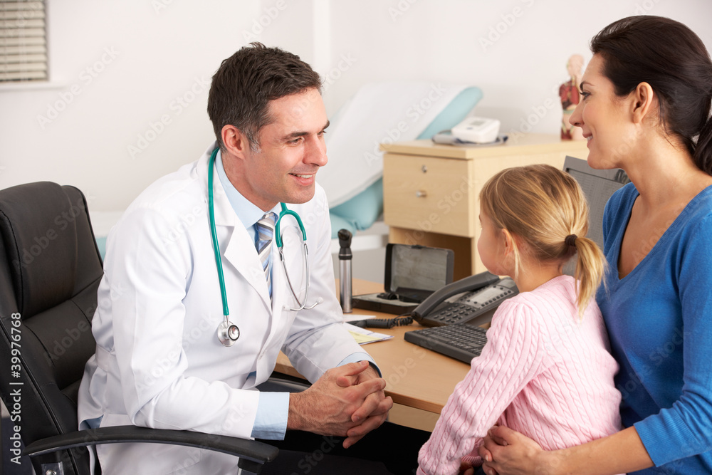 American doctor talking to young child and mother American doctor talking to young child and mother