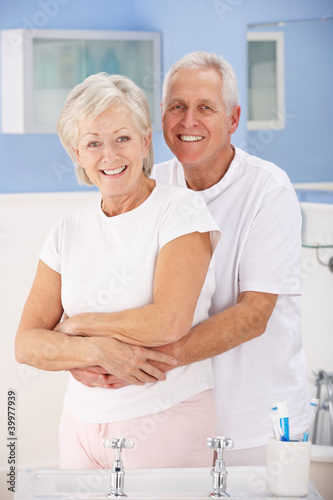 Senior couple hugging in bathroom