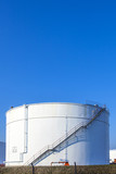 white tank in tank farm with blue sky