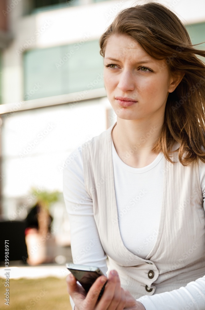 Bad message - unhappy woman with phone Bad message - unhappy woman with phone
