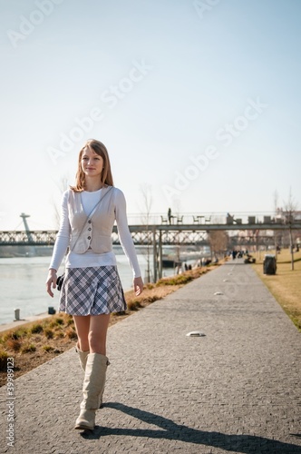 Beautiful young woman walking © Martinan