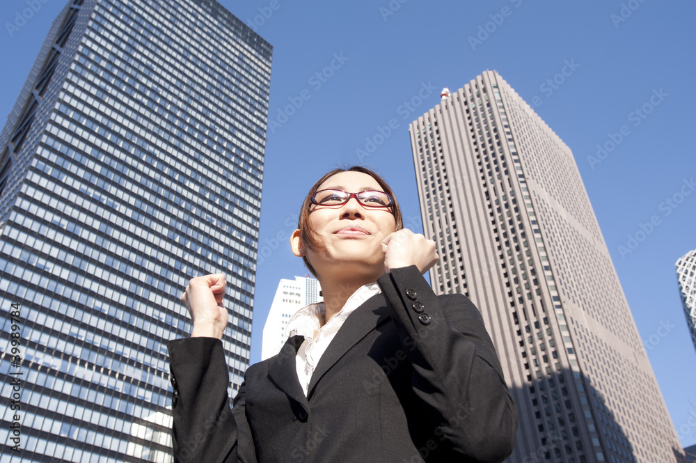 A building and a young businesswoman A building and a young businesswoman