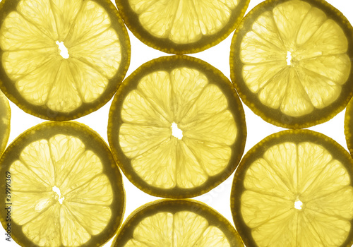 Lemon slices highlighted through the transparent glass